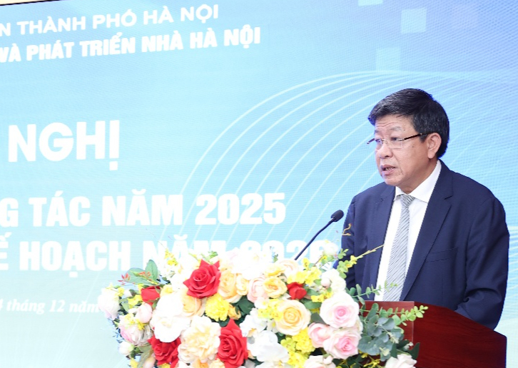 A person standing at a podium with flowers  AI-generated content may be incorrect.