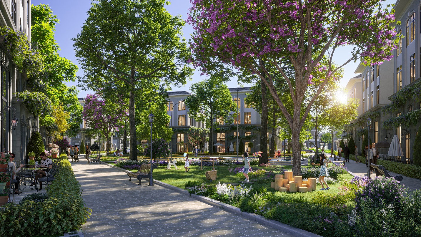 A park with trees and buildings  Description automatically generated