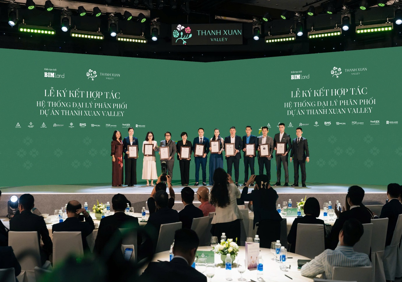 A group of people on a stage  AI-generated content may be incorrect.