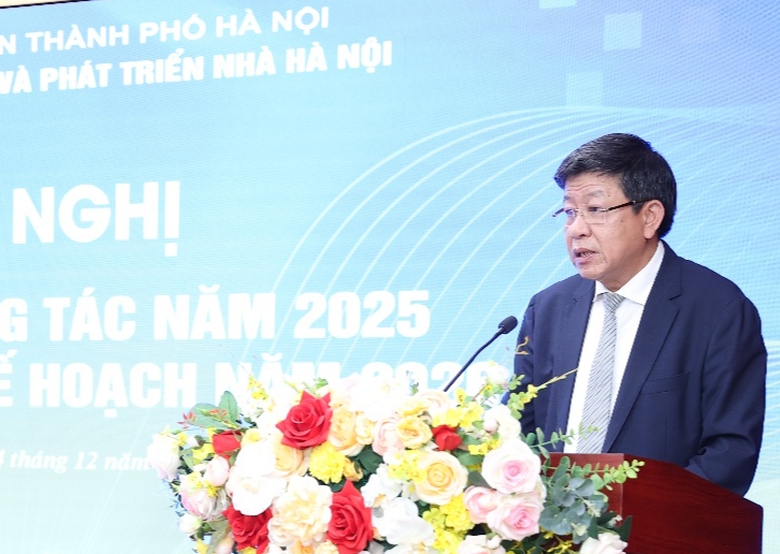 A person standing at a podium with flowers  AI-generated content may be incorrect.