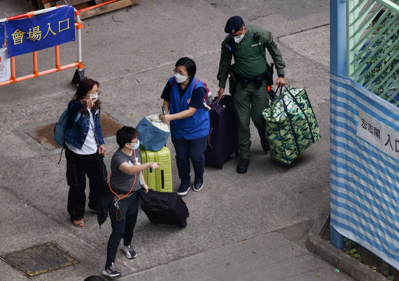 A group of people with luggage  AI-generated content may be incorrect.