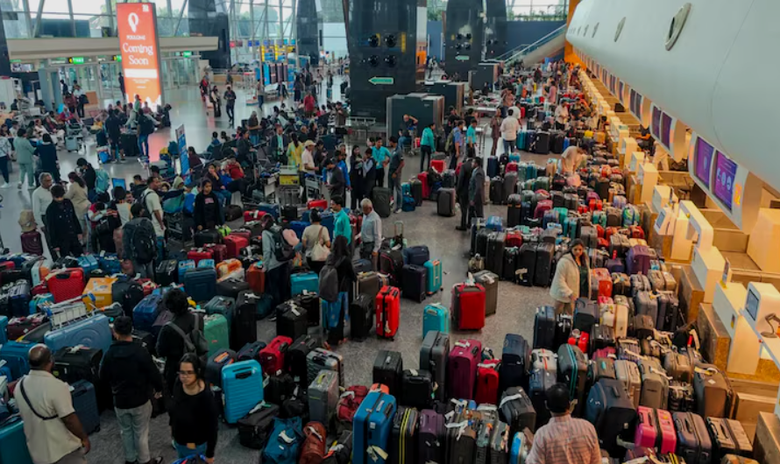 A group of people with luggage in a terminal  AI-generated content may be incorrect.
