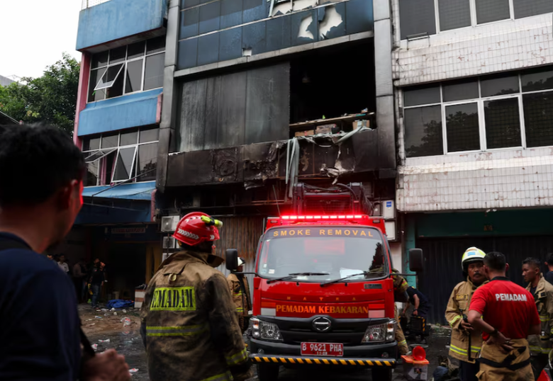 A firemen standing next to a fire truck  AI-generated content may be incorrect.