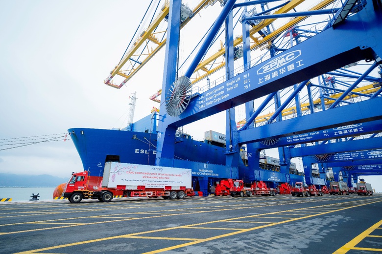 A large blue and yellow crane with trucks  AI-generated content may be incorrect.