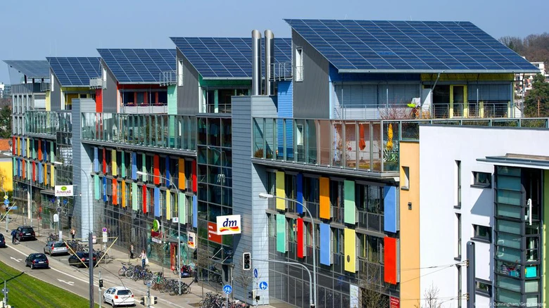 A row of multi-story buildings with solar panels  AI-generated content may be incorrect.