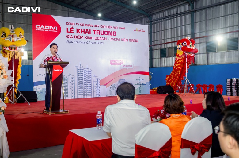 A person standing at a podium with a dragon on the stage  AI-generated content may be incorrect.
