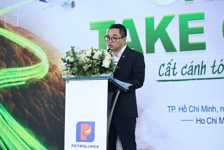 A person standing at a podium with flowers  AI-generated content may be incorrect.