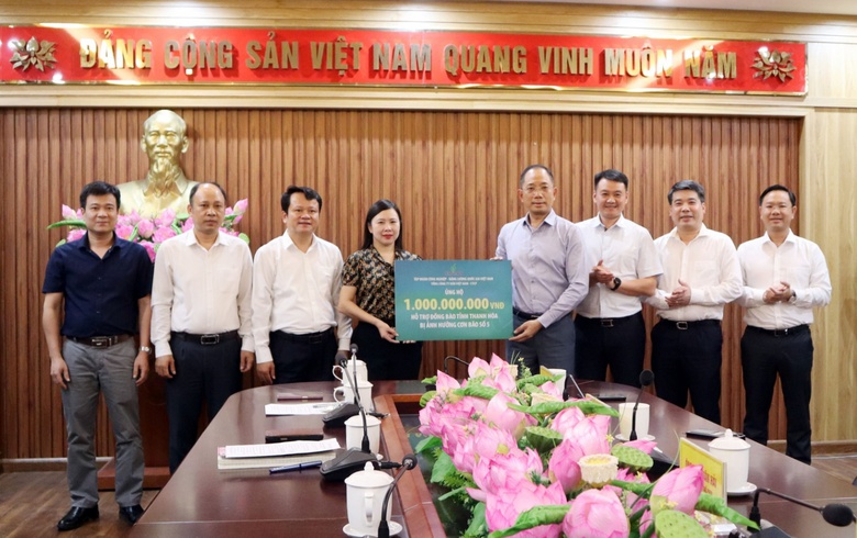A group of people standing in front of a table with flowers  AI-generated content may be incorrect.