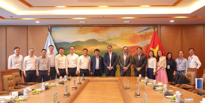 A group of people standing in front of a table  AI-generated content may be incorrect.