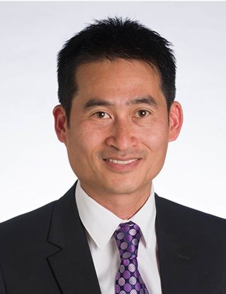 A person in a suit and tie  AI-generated content may be incorrect.