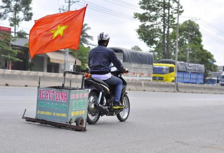 Anh Nguyen Huu Loi va chiec xe hut dinh tren QL51