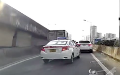 Vượt ẩu trên đường dẫn lên VĐ3, taxi lao vào hộ lan