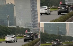 Nữ tài xế chở người trên nóc ô tô bị phạt 5 triệu đồng, trừ 6 điểm bằng lái