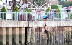 Chồng đánh vợ chảy máu đầu rồi nhảy xuống kênh trốn công an