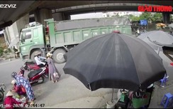 Video: Người phụ nữ thoát chết dưới gầm xe ben