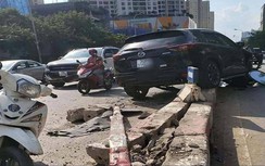 Hà Nội: Tài xế xe con húc văng dải phân cách, không chịu đo nồng độ cồn