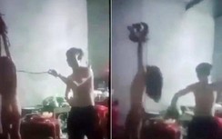 Truy tìm người cha cởi áo, cột tay con gái ruột treo trên trần nhà đánh đập