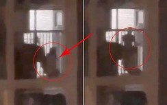 Vụ một phụ nữ trèo ra ban công cầu cứu: Công an mời hai người lên làm việc