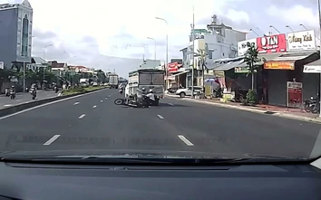 Xe tải chuyển làn ẩu, hất ngã hai người đi xe máy